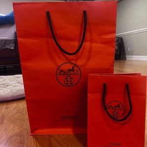 Two Hermes shopping bags and cases
